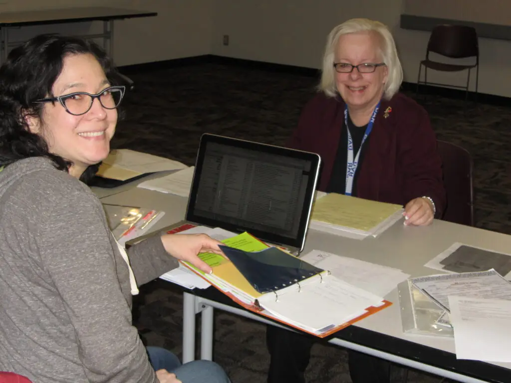 Members doing genealogy research together.